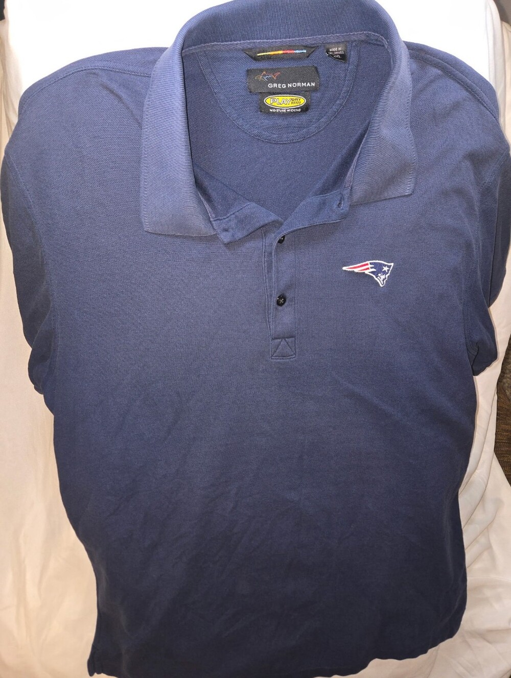 Greg Norman Collection Navy Polo with New England Patriots Logo